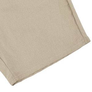 Close-up of high-quality stitching and breathable linen blend fabric texture on polo set