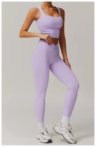 Detail of lavender yoga top with wide straps and V-shaped ruched stitching design