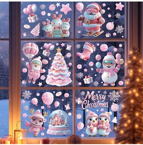 Detailed Christmas window stickers with pink and white Santa, snowman and snow house scenes