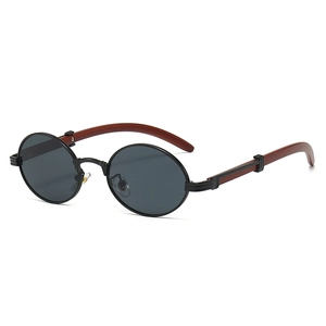Vintage oval sunglasses with wood grain temples and black frame shown in a side view