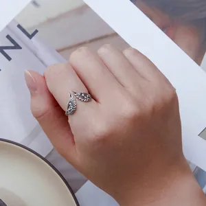 Retro S925 sterling silver angel wing open ring with detailed feather texture on finger
