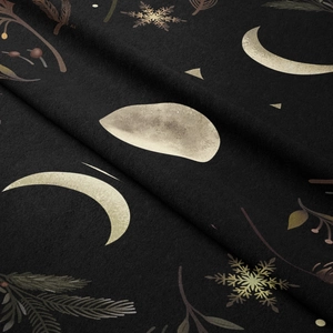 Close-up of bohemian moon phase tapestry with soft fabric texture and golden floral prints