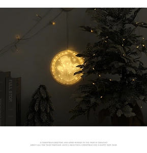 Detail of warm white LED hanging light with snowman pattern for Christmas decor