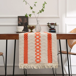 Minimalist beige and orange cotton linen table runner with geometric woven patterns