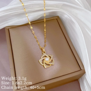 Detail of gold flower pendant with pearl and zircon inlay including size measurements