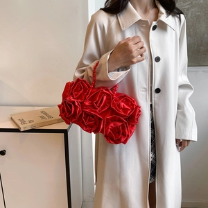 Elegant red silk handbag featuring 3D rose flower design and beaded handle for evening parties
