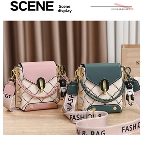 Detail of vintage diamond quilted crossbody bags with pink woven straps and bear charms