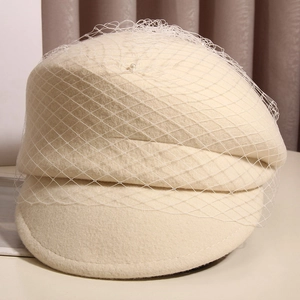 Elegant cream wool beret with pearl-studded mesh veil in classic French vintage style