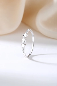 Close-up of S925 sterling silver triple star ring featuring sparkling zircon inlay details