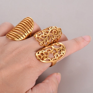 Three-piece set of gold stainless steel open rings with hollow floral and star patterns