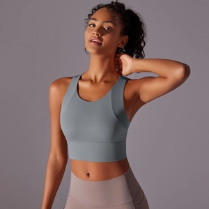 Detail view of moisture-wicking sports bra and high-waist leggings on an athletic model