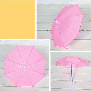 Pink mini umbrella for 18-inch dolls, featuring a curved handle and fabric canopy