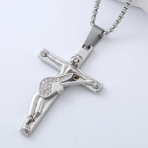 Macro view of silver crucifix pendant with white zircon inlays on a stainless steel chain