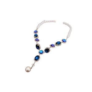 Elegant Y-shaped pearl necklace with blue oval gems and sparkling crystal accents