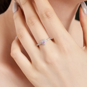 Elegant S925 sterling silver ring with pink heart zircon on model's finger