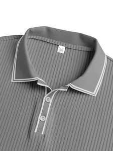 Detail of grey polo shirt neckline with white trim and vertical ribbed fabric texture