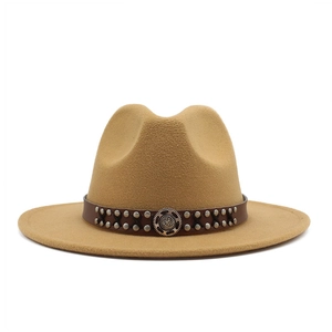 Detail of wool felt fedora hat featuring a brown leather band with silver studs