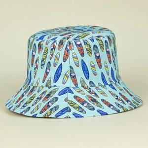Detailed pattern of colorful surfboards and The Ocean Calling text on a blue bucket hat