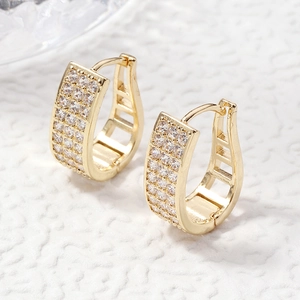 U-shaped gold hoop earrings with sparkling cubic zirconia pavé and hinged snap closure