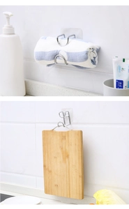 Detail showing adhesive wall-mounted stainless steel U-hooks for kitchen and bathroom use