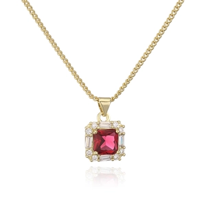 Detail of 18K gold plated necklace with a red square zircon pendant and white crystals