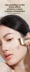 Macro detail of crescent foundation brush applying liquid base for seamless makeup finish