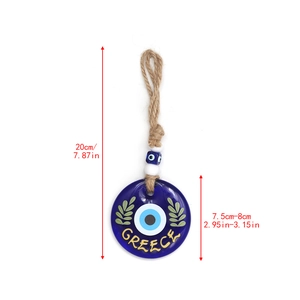 Blue glass evil eye charm detail with dimensions 7.87in length and 3.15in diameter
