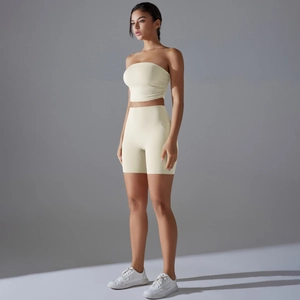 Side view of pale yellow ribbed sports set featuring seamless crop top and high waist shorts