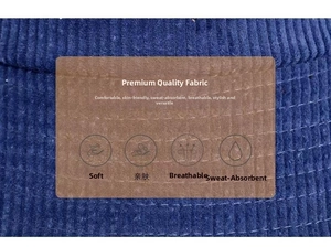 Detailed close-up of dark blue corduroy fabric texture with soft breathable fibers