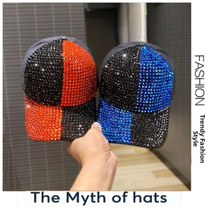 Detail of two sparkling rhinestone baseball caps in red-black and blue-black checkerboard