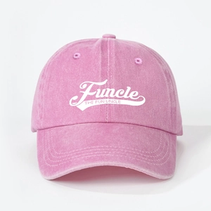 Detail of pink washed cotton baseball cap featuring white Funcle The Fun Uncle embroidery