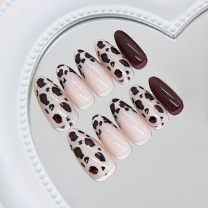 French hazelnut leopard cat-eye press on nails in almond shape on heart mirror tray