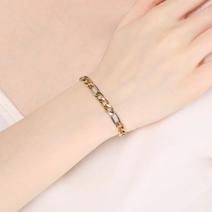 Minimalist two-tone stainless steel 3:1 NK chain bracelet on model's wrist for daily wear