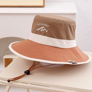 Close-up of tricolor outdoor kids sun hat showing explorer embroidery and fabric texture