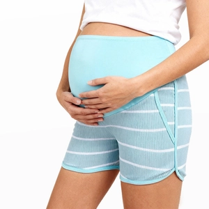 Detail of high-waisted maternity shorts showing the supportive belly band and blue stripes