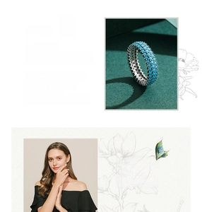 Detail of vintage S925 sterling silver ring with three rows of turquoise gemstones