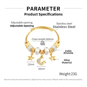 Detail view of adjustable gold bangle with star moon pendants and synthetic cubic zirconia