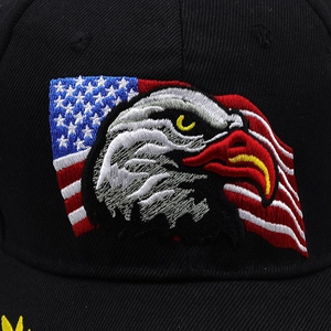 Close-up of eagle embroidery with American flag on black cotton baseball cap