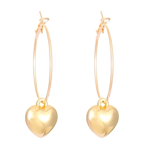 Polished gold heart drop earrings with large round hoops on a white background