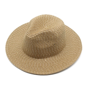 Summer woven straw sun hat with sequins and wide brim for beach vacations in light brown