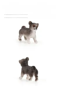 Macro shot of a miniature puppy figurine showing detailed grey and white fur texture
