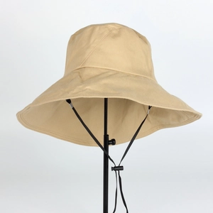 Detail of khaki wide-brim sun hat with black chin strap on professional stand