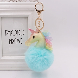 Rainbow unicorn glitter keychain with fluffy blue faux fur pompom and golden clip