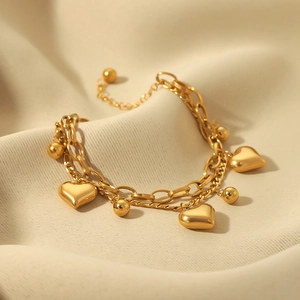 Double-layered 18K gold plated stainless steel bracelet with hollow heart pendants