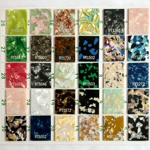 Detailed catalog of thirty diverse acetate pattern samples for large hair claw clips