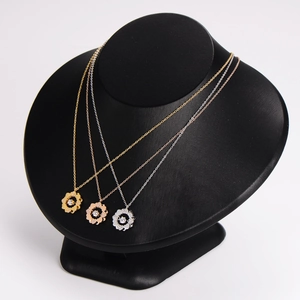 Three-color stainless steel clover heart necklaces with crystal pendants on neck models