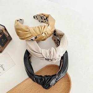 Three-piece set of knotted PU leather headbands in gold, beige and black with leopard lining