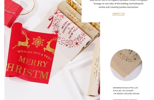 Detail of Christmas table runner featuring gold foil reindeer and snowflake linen texture