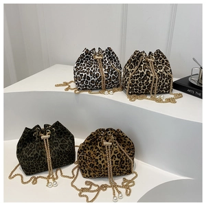 Chic leopard print bucket bags with gold chain straps and pearl drawstring accents