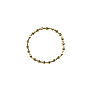 Detailed view of gold plated stainless steel beaded bracelet with alternating bead sizes